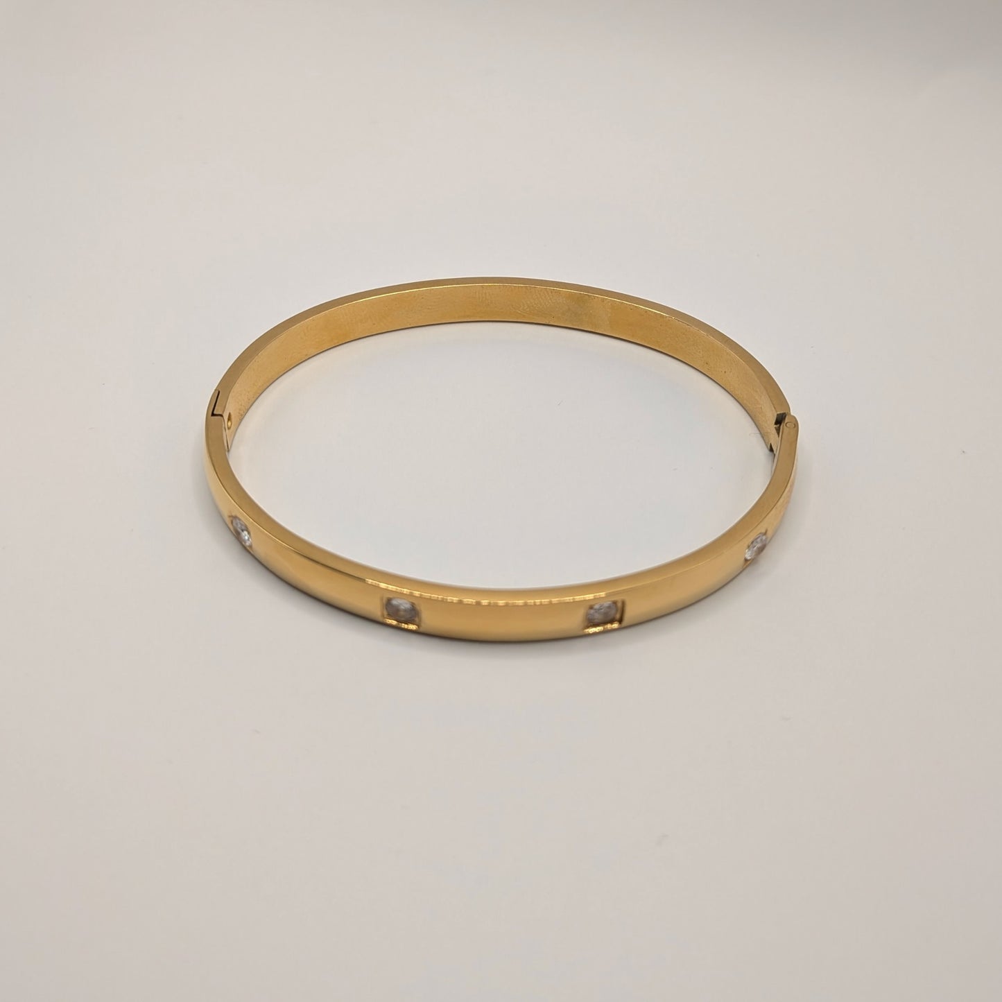 Gold Plated Titanium Steel Bangle with Subtle Crystal Accents