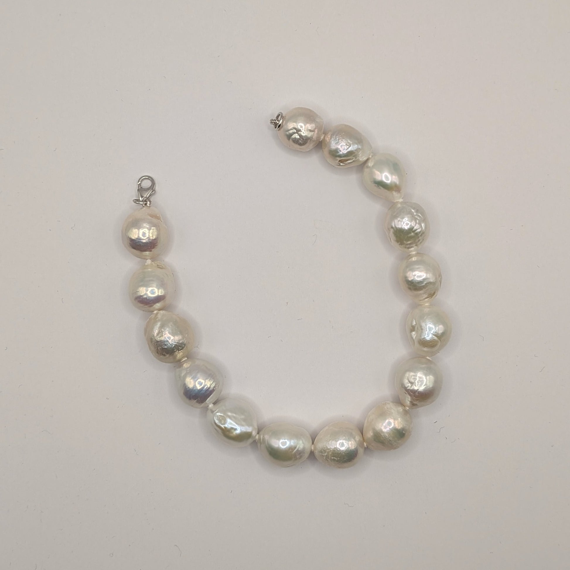 Pearl bracelet on a light gray background