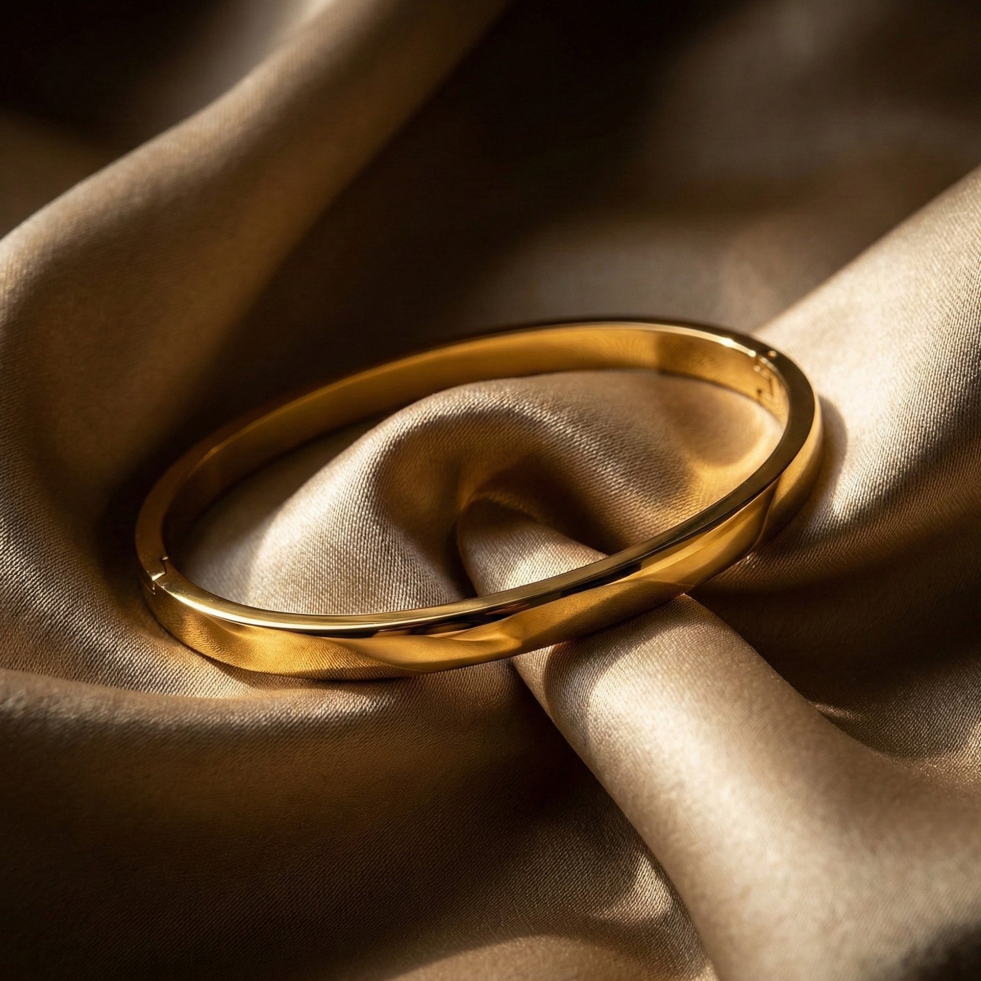 Gold ring on a textured beige fabric background