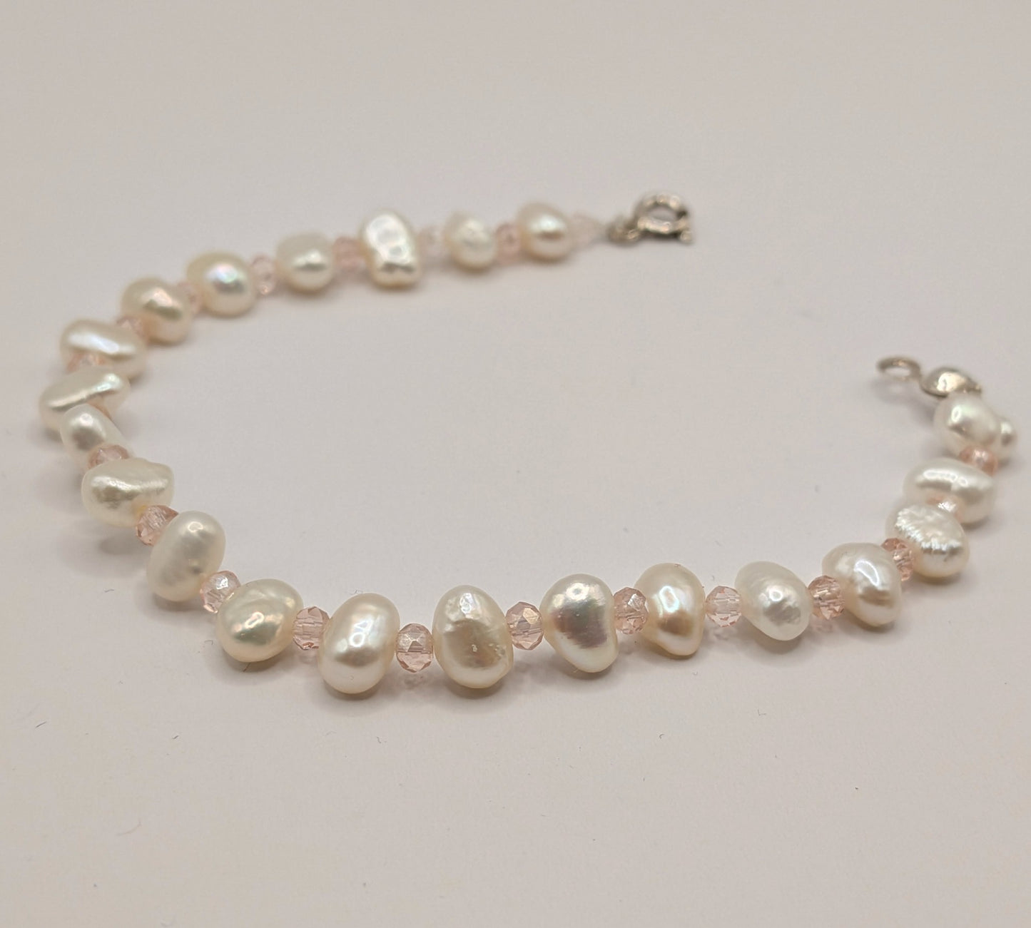 Pearl necklace on a light background
