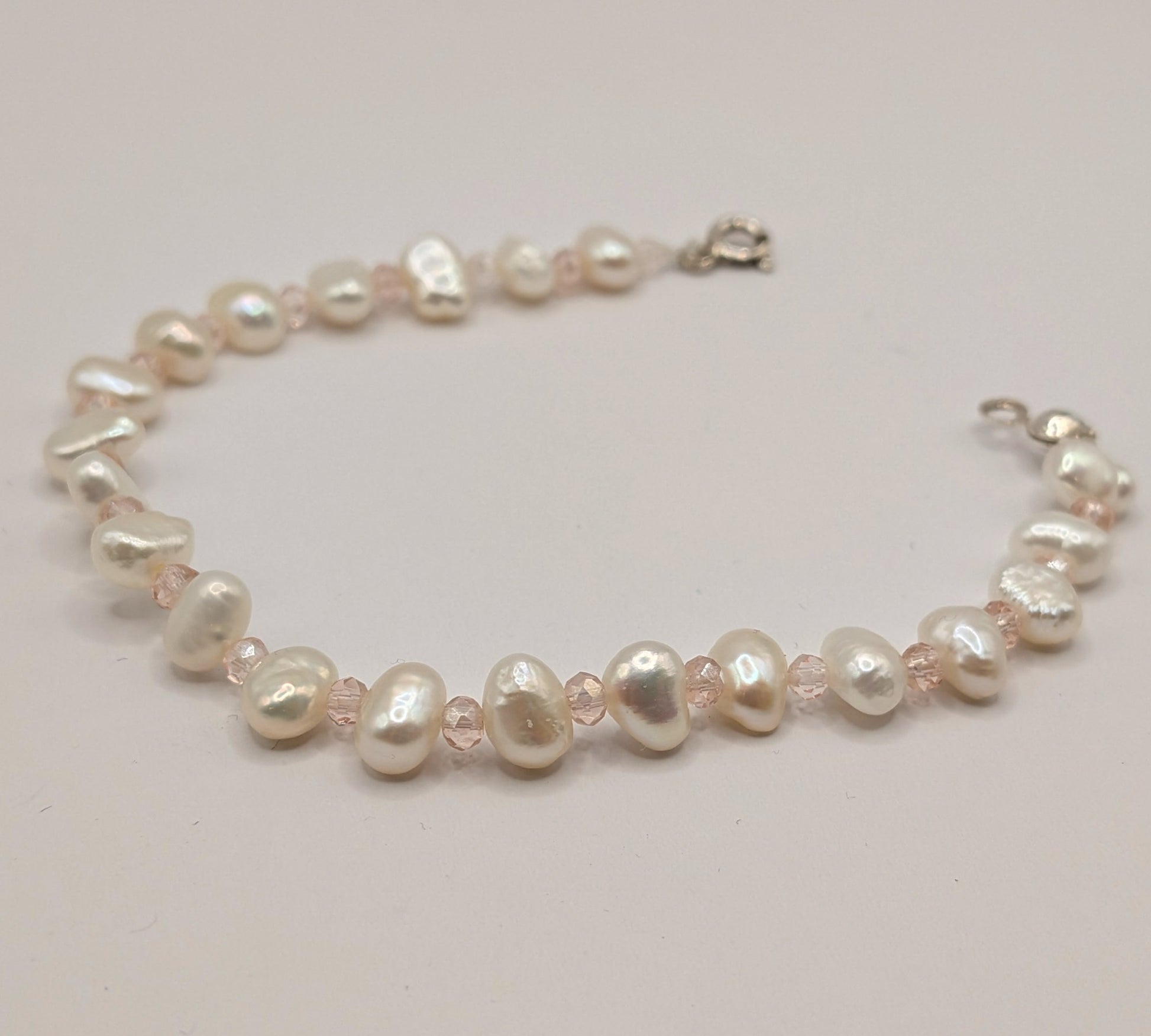 Pearl necklace on a light background