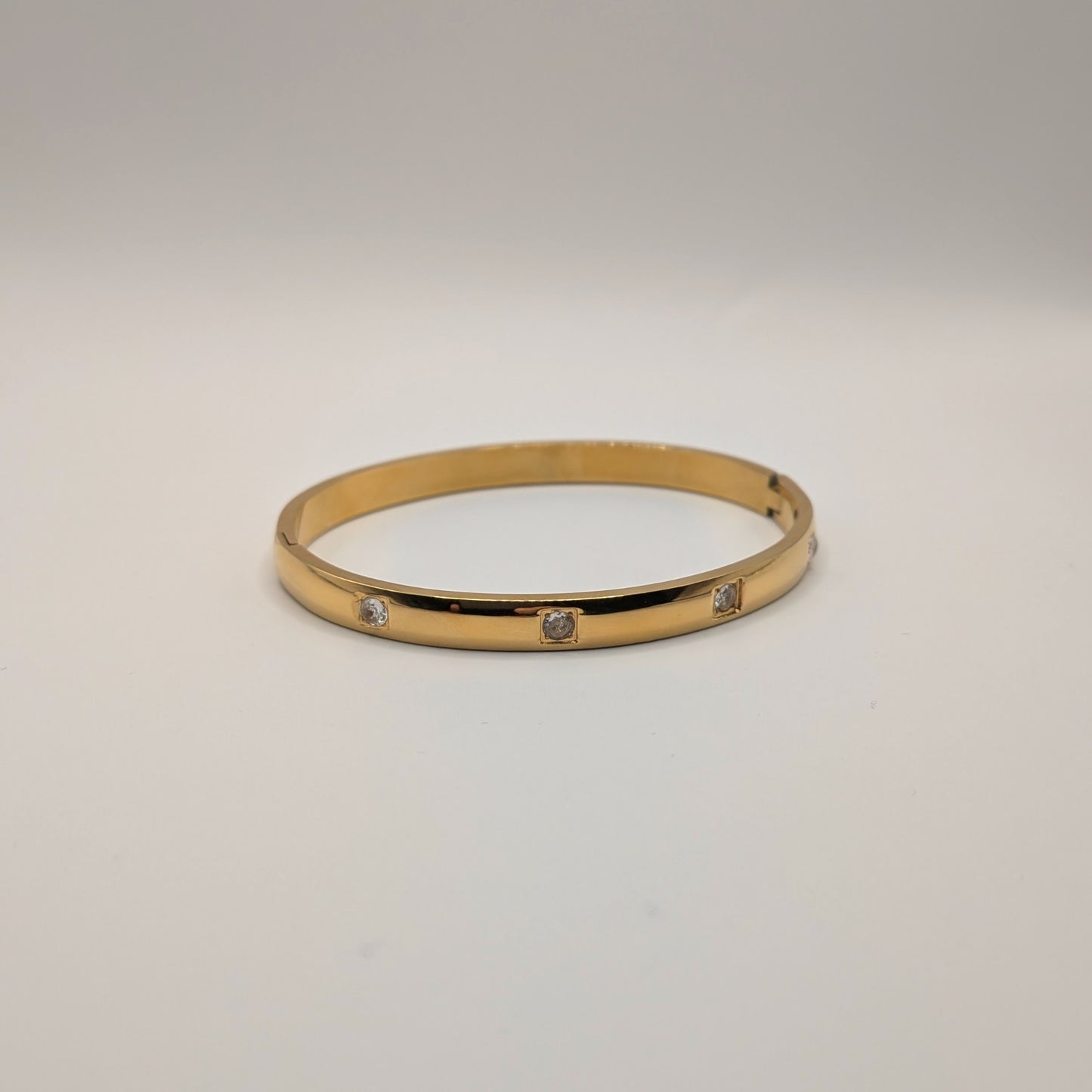 Gold Plated Titanium Steel Bangle with Subtle Crystal Accents