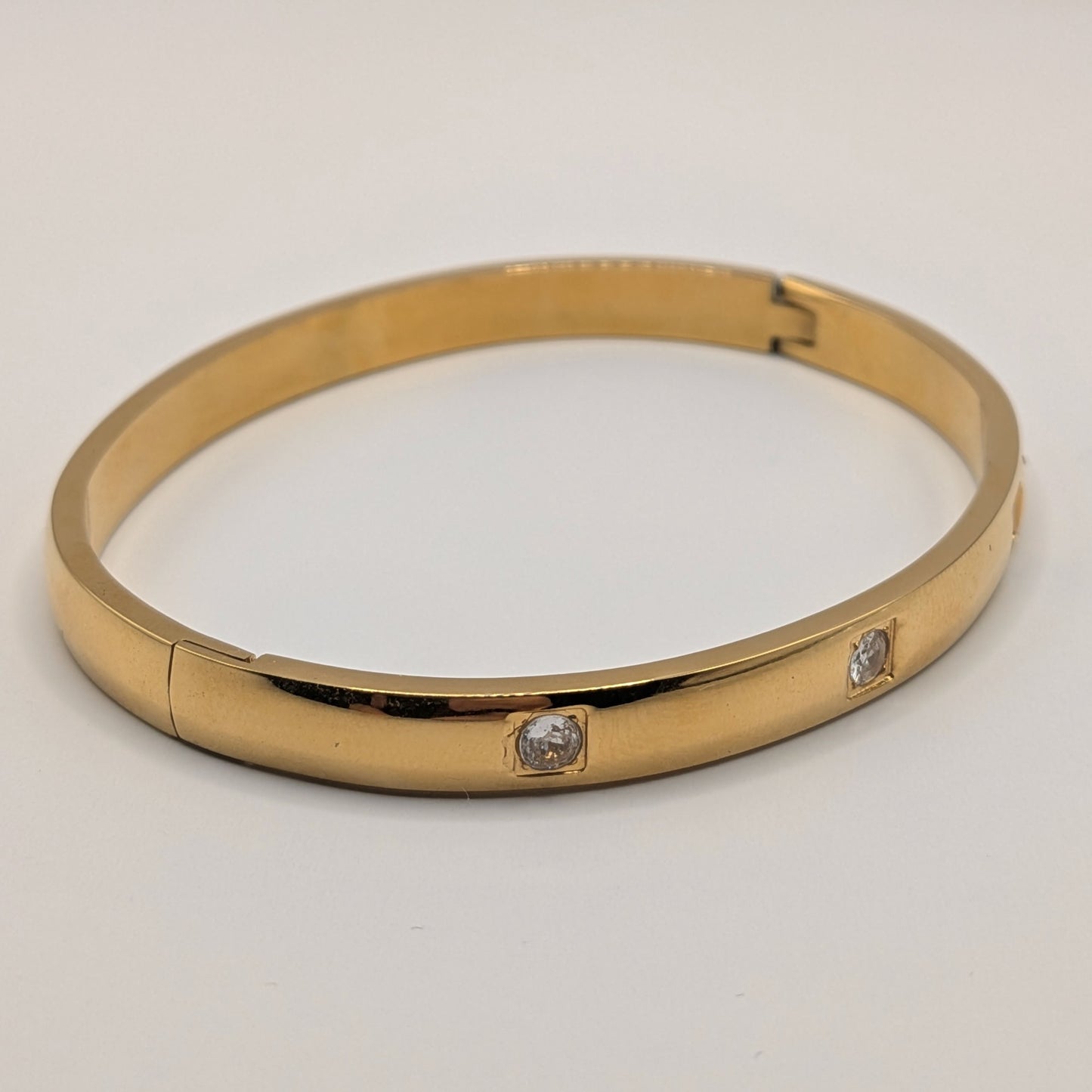 Gold Plated Titanium Steel Bangle with Subtle Crystal Accents